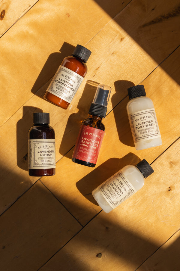 All 5 items in the travel kit are featured here, bathing in beautiful morning light. This image include the travel size conditioner, shampoo, hand sanitizer, body wash and lotion.