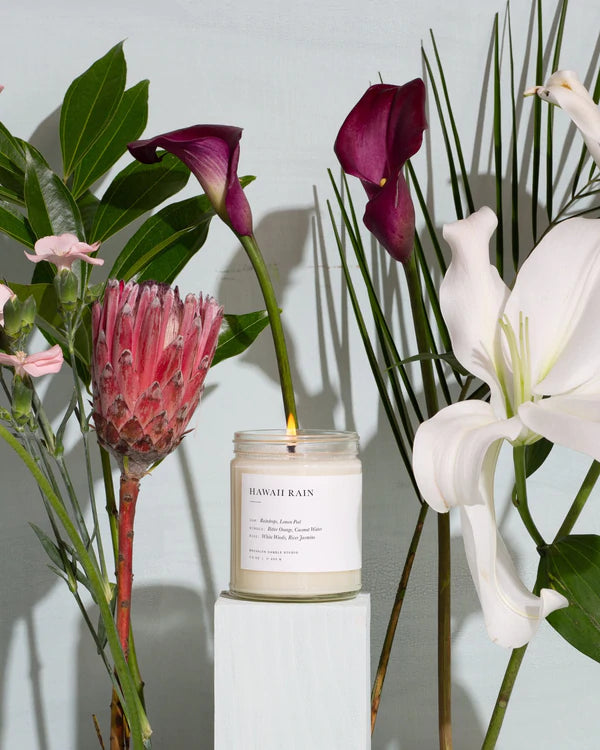A Brooklyn Candle Studio jar in Hawaii Rain scent with tropical flowers