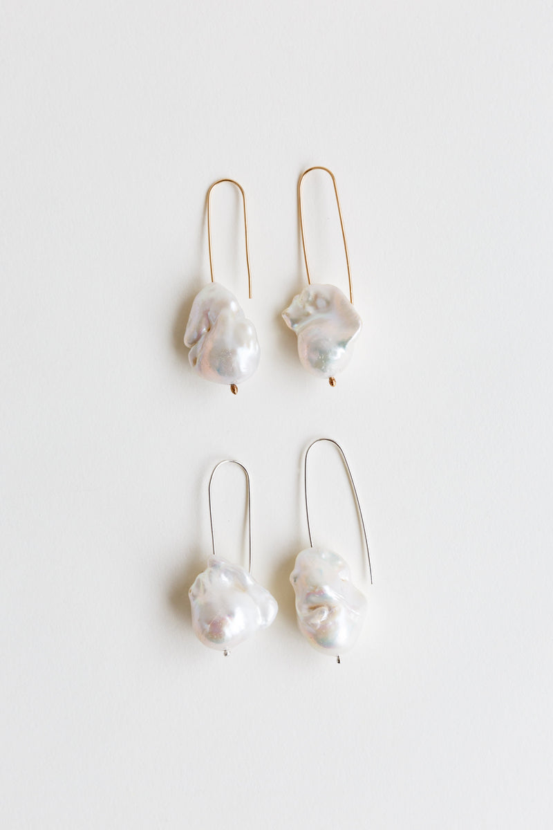 Pairings of Moon+Arrow's pearl drop earrings in gold-fill and silver wires