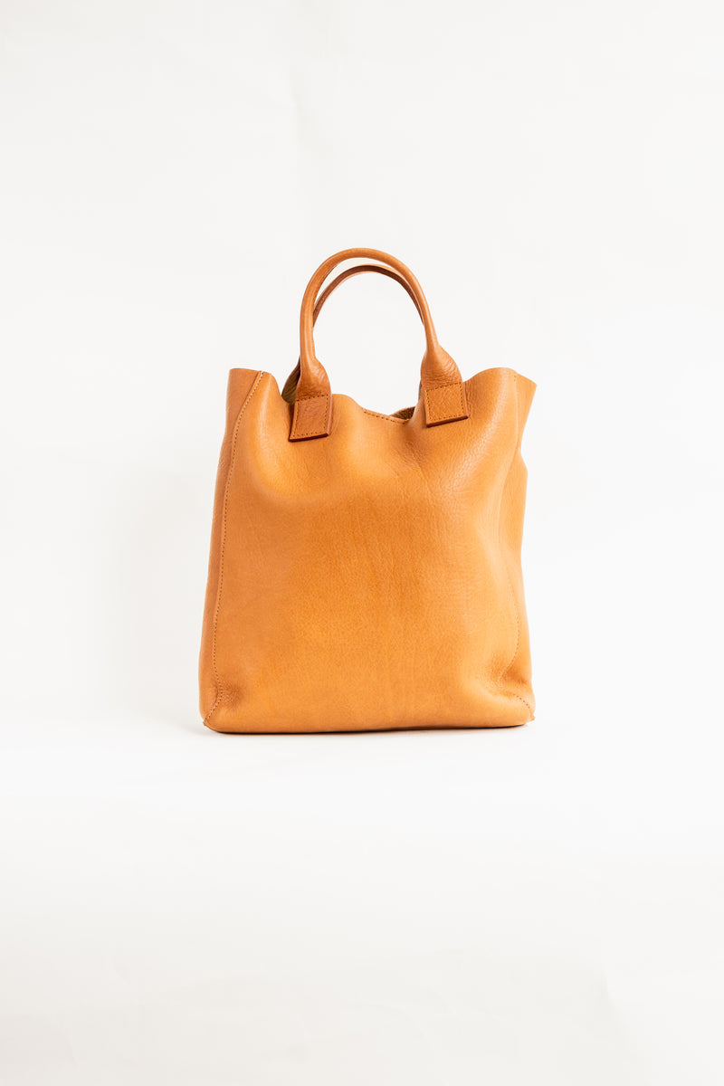 Soft, thick Argentinian small leather tote bag with a short strap that sits under the arm