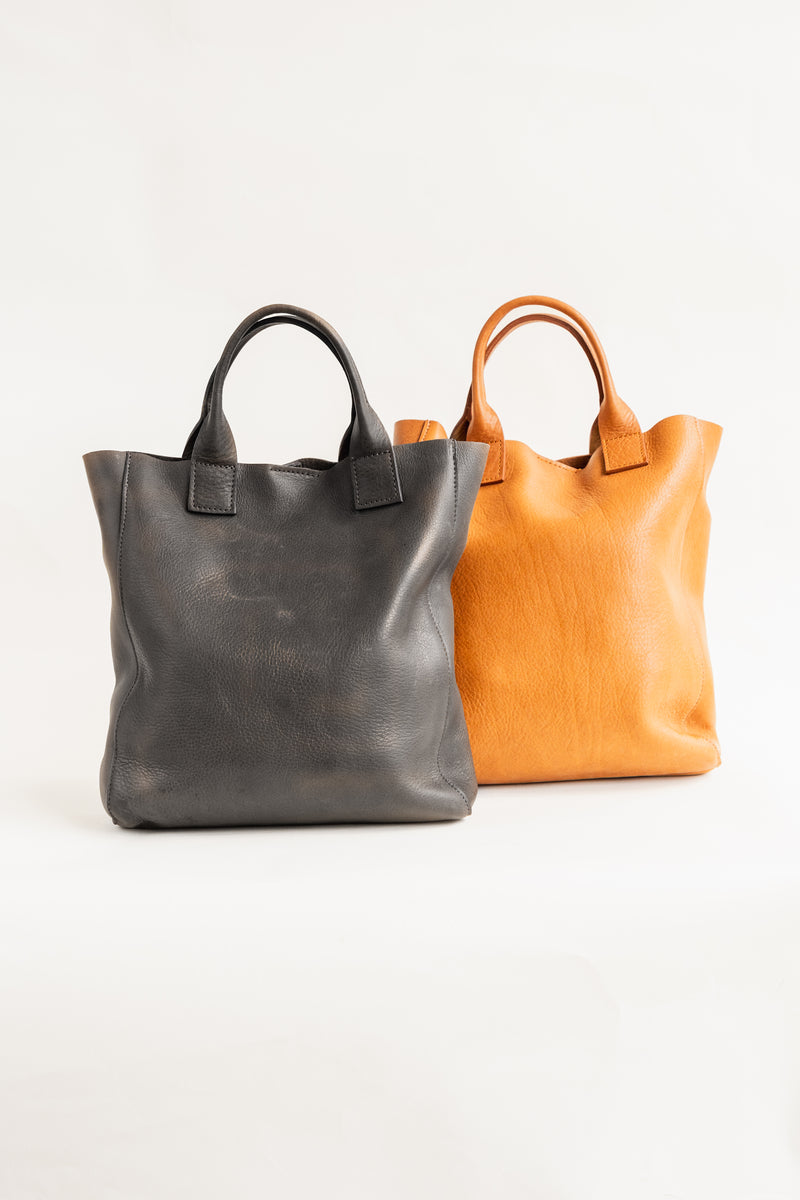 Soft, thick Argentinian small leather tote bag with a short strap that sits under the arm
