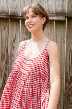 Woman wearing a beautiful Injiri Neel red slip dress