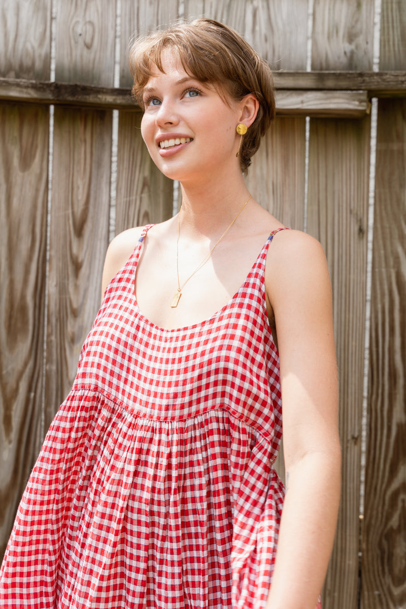 Woman wearing a beautiful Injiri Neel red slip dress