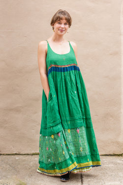 Woman wearing a beautiful green Injiri Rasa Slip Dress