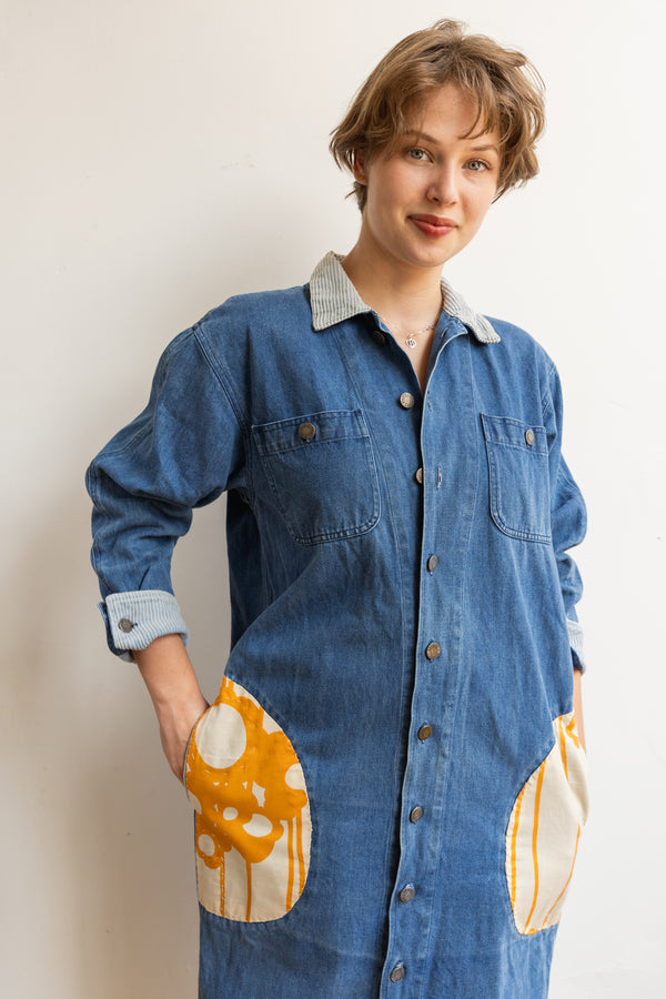 Person wearing a Half Skein long sleeve denim jacket with patches