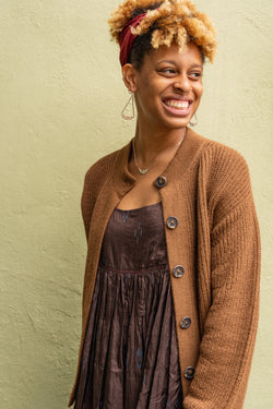 Person wearing a Yanawara Tintaya Cardigan in Brown