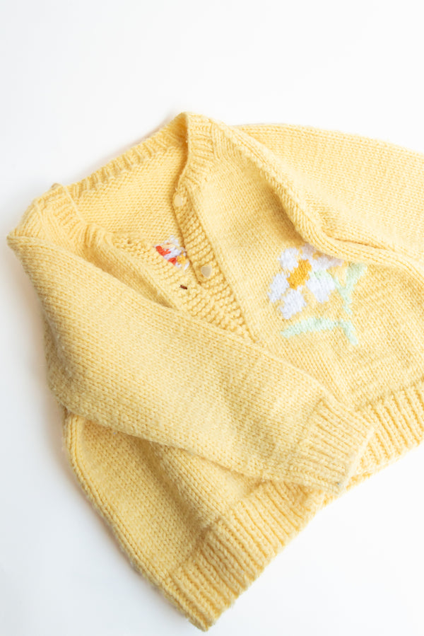 Handknit yellow sweater
Dandelion design sweater
Girl pattern sweater
Vintage handknit sweater
Gus & Way sweater
Retro dandelion knitwear
Handmade children’s sweater
Unique girl design cardigan
Yellow knit sweater
Artisan-made vintage sweater
Handcrafted yellow cardigan
Whimsical knitwear for kids
Gus & Way vintage clothing
Ethical handknit sweater
Playful dandelion sweater