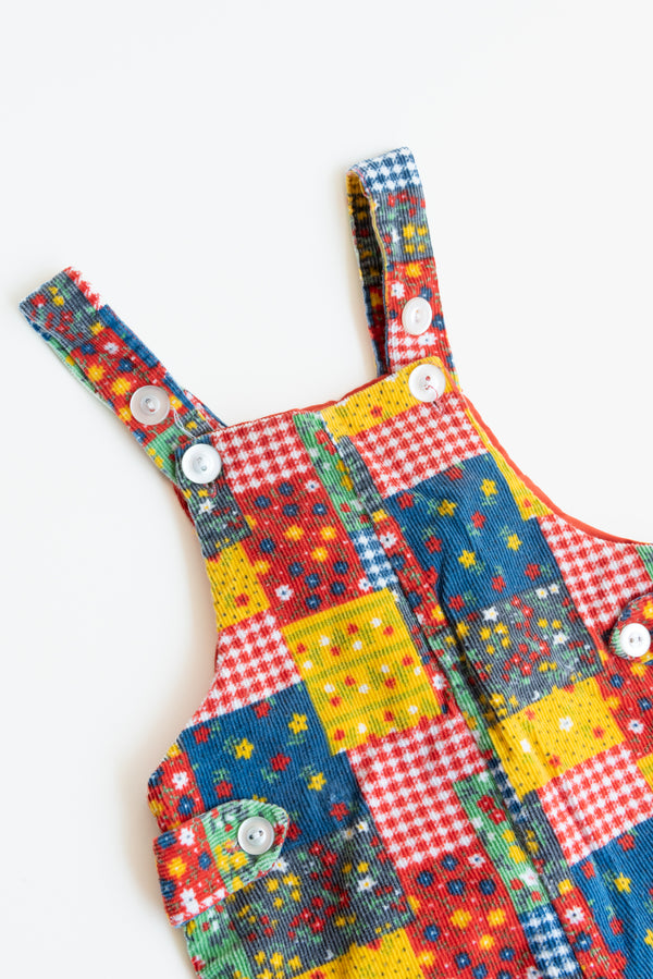 Corduroy Patchwork Overalls for kids from Gus & Way, featuring a unique multicolored patchwork design in soft corduroy fabric, with adjustable straps and practical pockets.