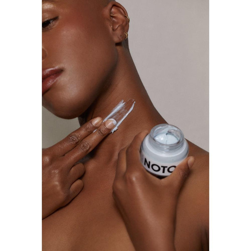 A person applying Noto Moisture Riser Cream, a powerful yet lightweight hyaluronic acid moisturizer cream