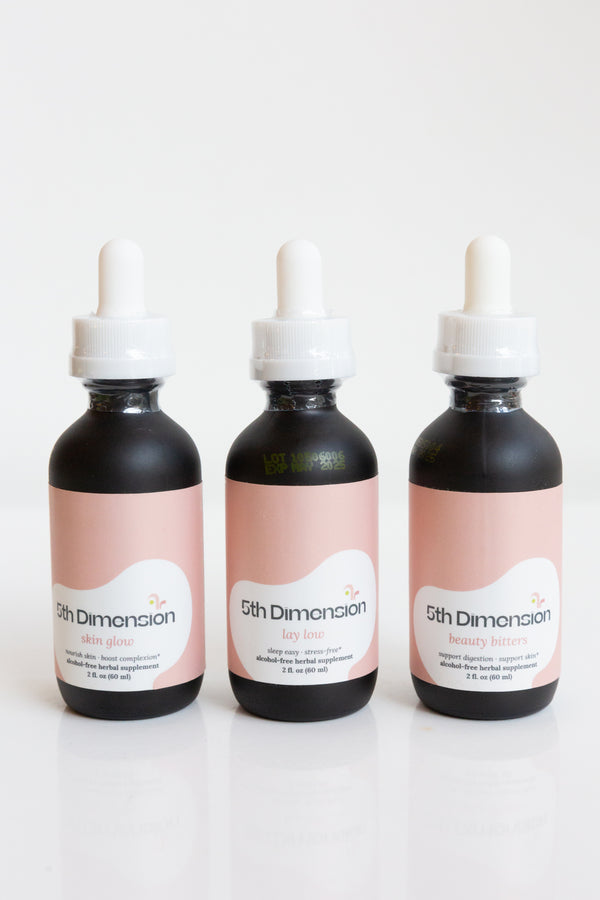 Bottles of 5th Dimension Herbal Tinctures