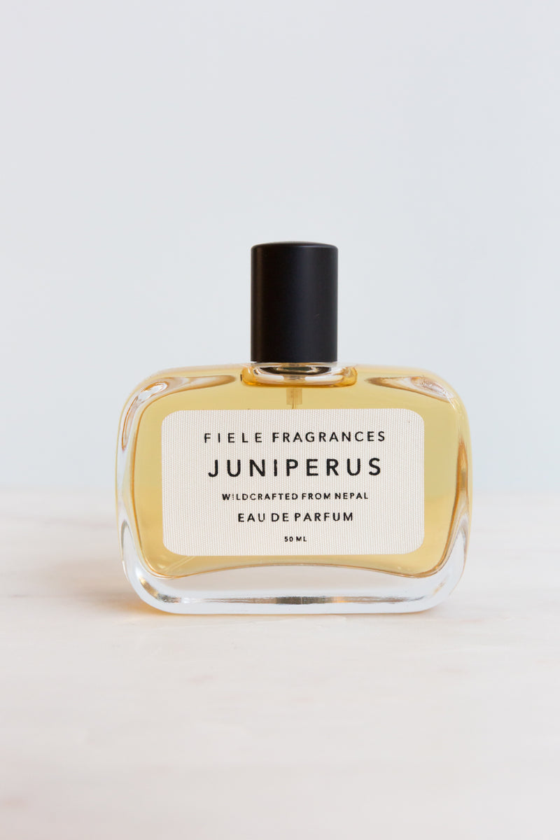 A bottle of Juniperus Fiele Fragrances, extracted from plants and crafted from raw materials from around the world