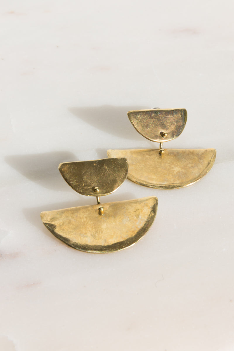 Moon+Arrow's two moon earrings in brass
