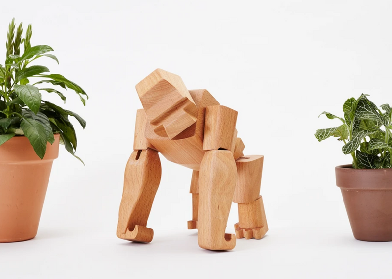 Areaware Hanno Gorilla wooden children's toy perched upon a table top