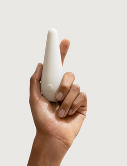 A person holding a Maude Vibe Personal Massager