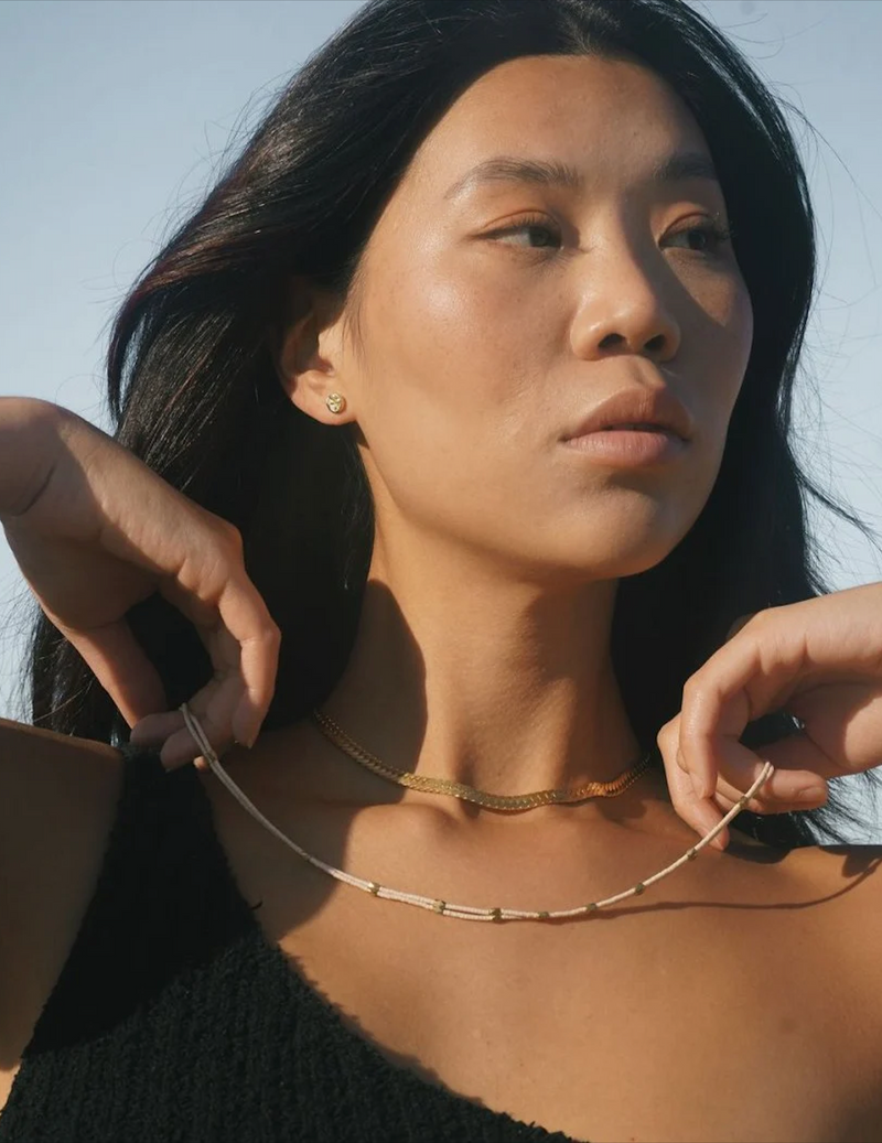 Person wearing a Satomi Double Strand Necklace