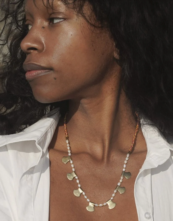 Person wearing a Satomi Blade Collar necklace