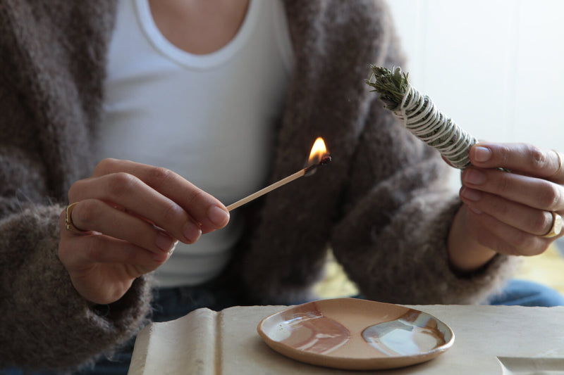 A person using a Terra Luna Herbal Smoke Stick