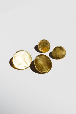 Pairs of Moon+Arrow's full moon stud earrings