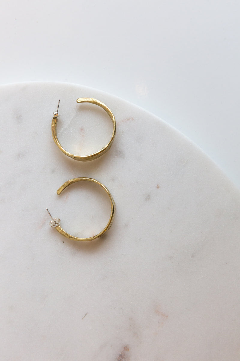 Pair of Moon+Arrow's textured brass hoops earrings