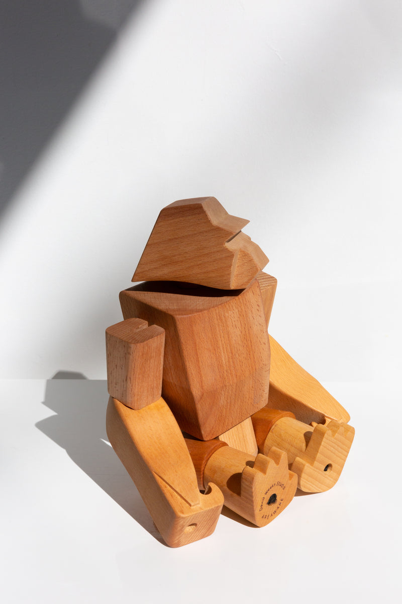Areaware Hanno Gorilla wooden children's toy perched upon a table top
