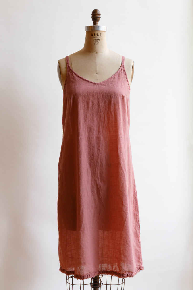 Handcrafted in India by weaver artisans using hand-spun yarn, this charming light weight rose slip by Auntie Oti is on display on a mannequin