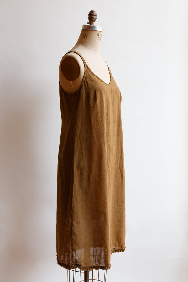 Handcrafted in India by weaver artisans using hand-spun yarn, this light weight toffee slip by Auntie Oti is on display on a mannequin