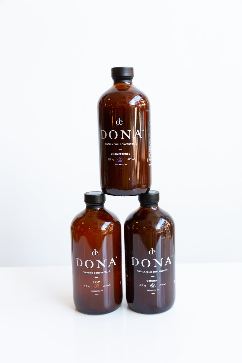 Bottles of Dona Tumeric Concentrate