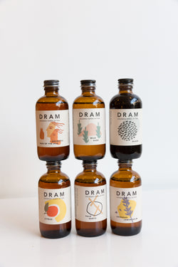 Stacked bottles of Dram Colorado Herbal Bitters