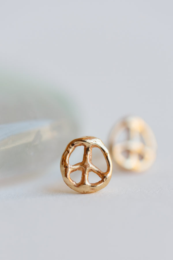 Emilie Shapiro peace sign stub earrings made with 14k recycled gold