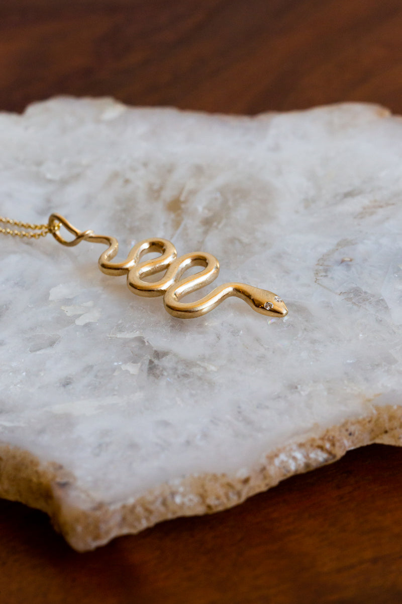 Halcyon ASP necklace, handmade out of 14k solid yellow gold with cruelty free diamonds for eyes