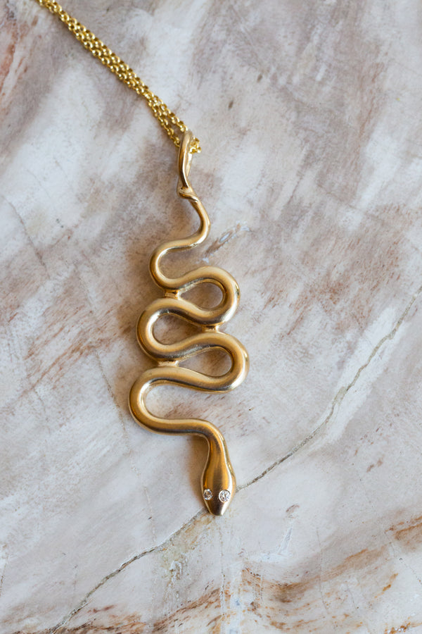 Halcyon ASP necklace, handmade out of 14k solid yellow gold with cruelty free diamonds for eyes