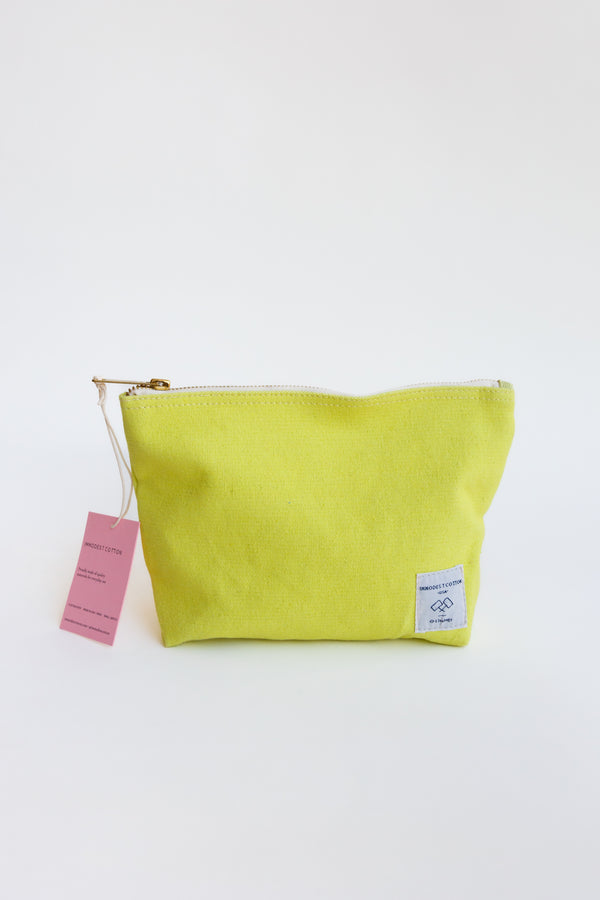 Yellow Immodest Cotton Pouch, functioning perfectly as a toiletry bag or pencil case