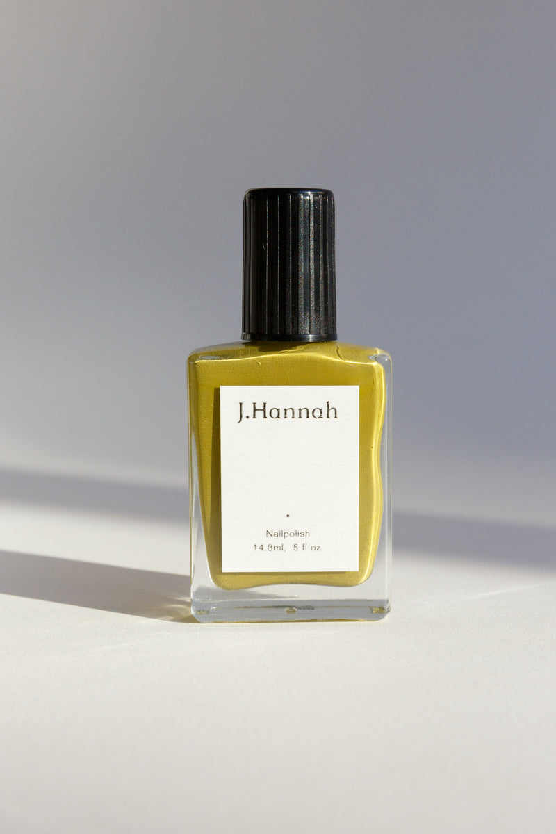 A bottle of green-yellow nail polish by JHannah
