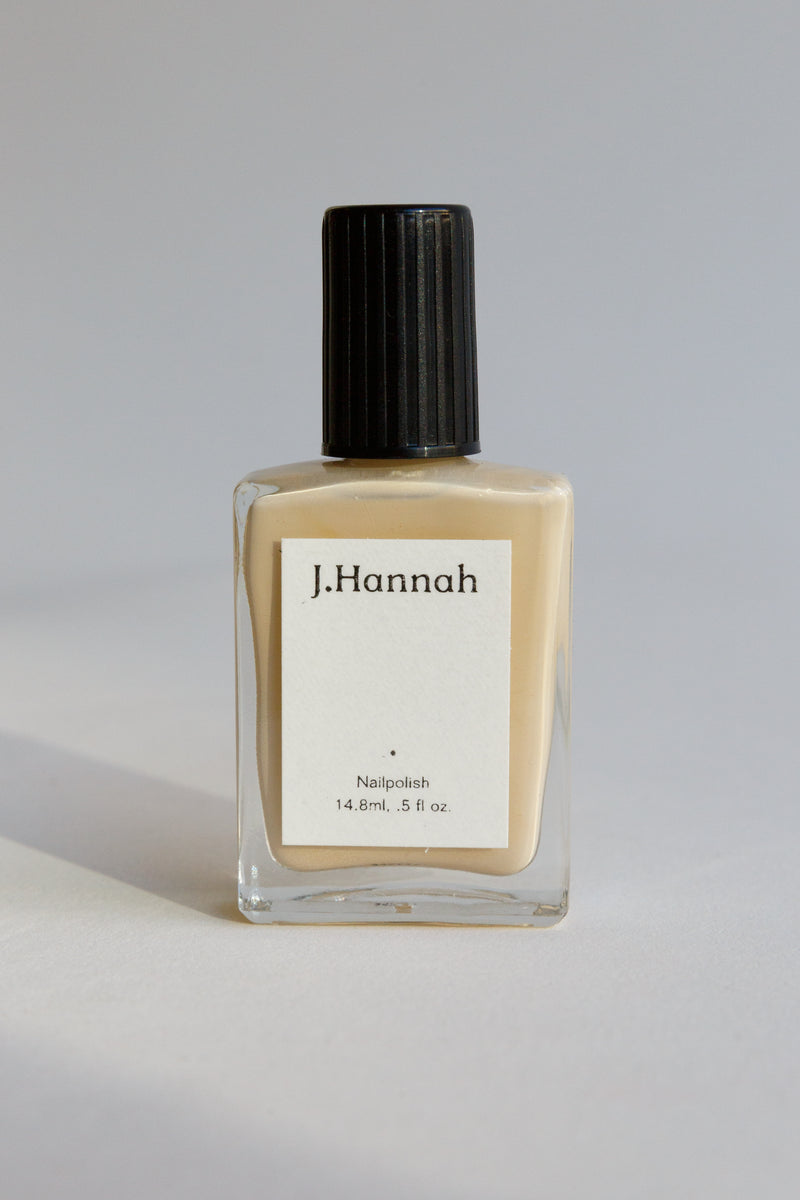A bottle of cream nail polish by J.Hannah