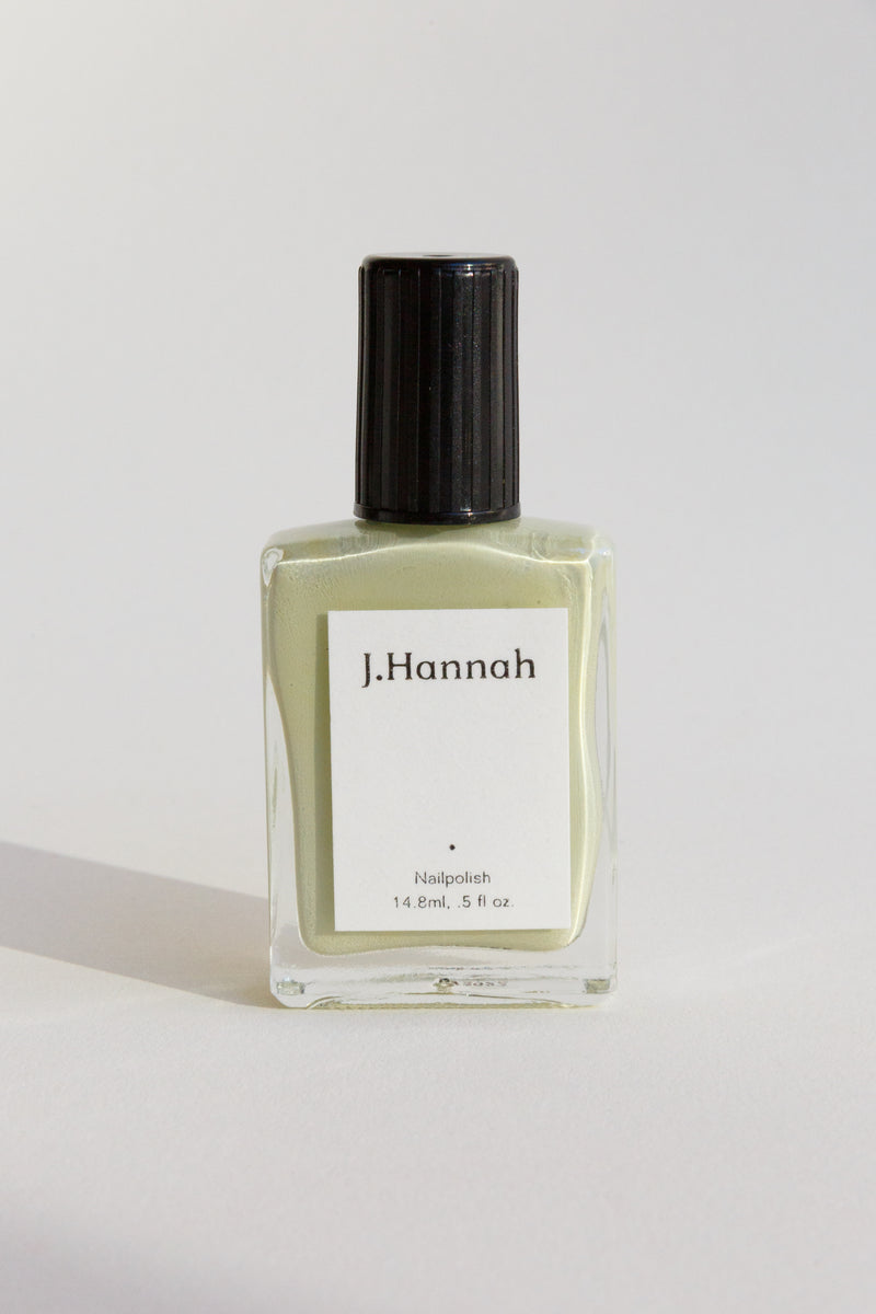 A bottle of light green nail polish by J.Hannah