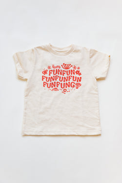 A baby Joan Ramone fun fun fungi t-shirt, handprinted on super soft 100% organic cotton with non-toxic, waterbased ink, laying flat on a table