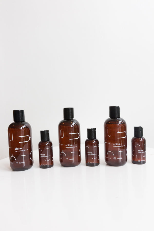 Bottles of Maude Shine Lubricant, a 100% natural, organic and ultra-hydrating lubricant