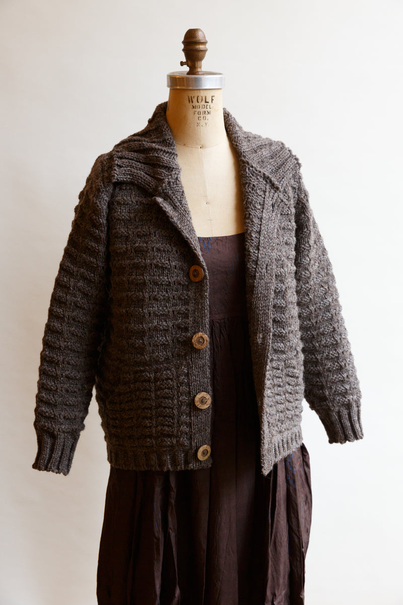 Handcrafted jacket made of 100% virgin wool with wooden buttons created by McConnell Woollen Mills, an Irish knitwear brand located on the west coast of Ireland, is on display on a mannequin