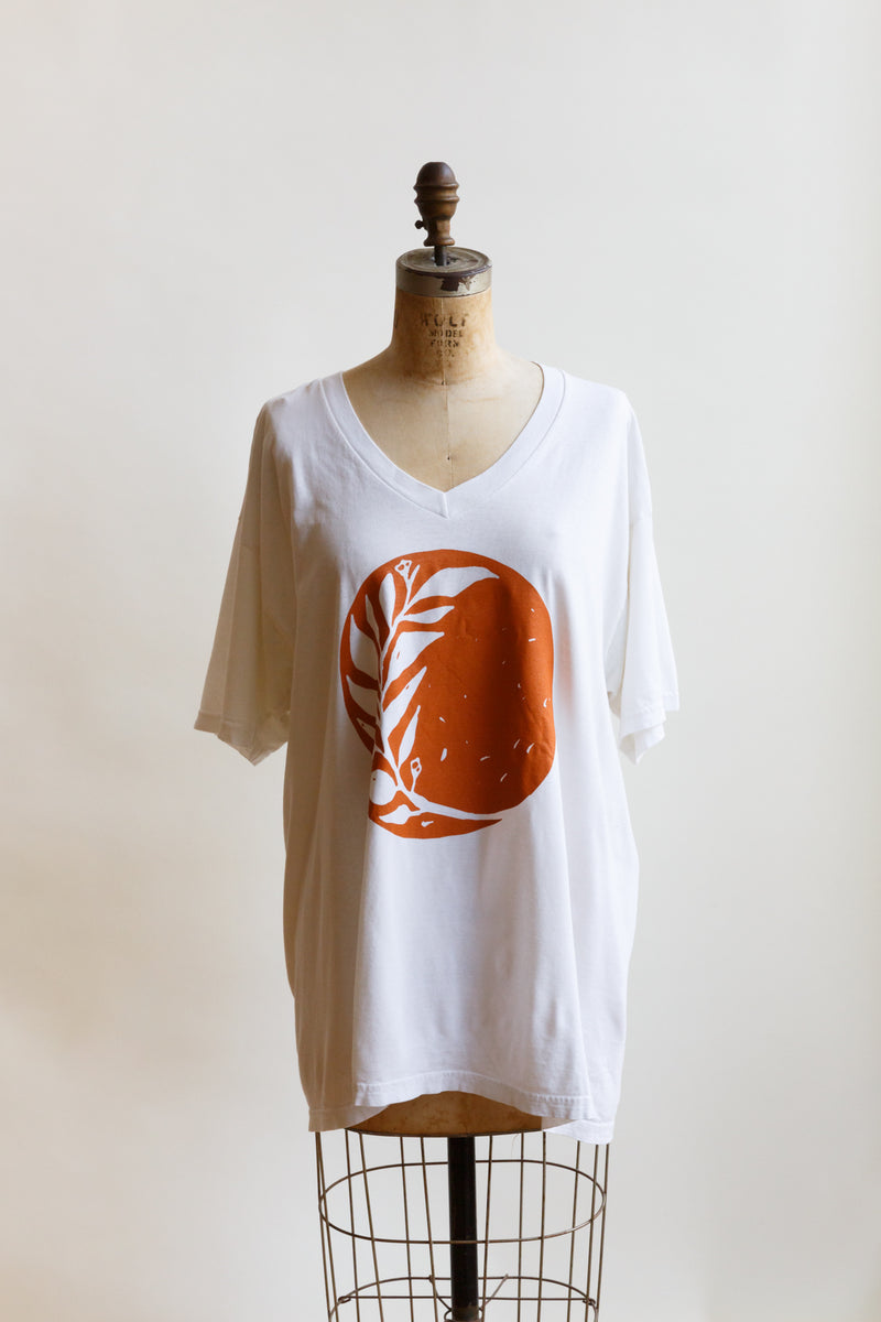 Moon+Arrow's newest v-neck t-shirt celebrating the Fall Equinox is on display on a mannequin