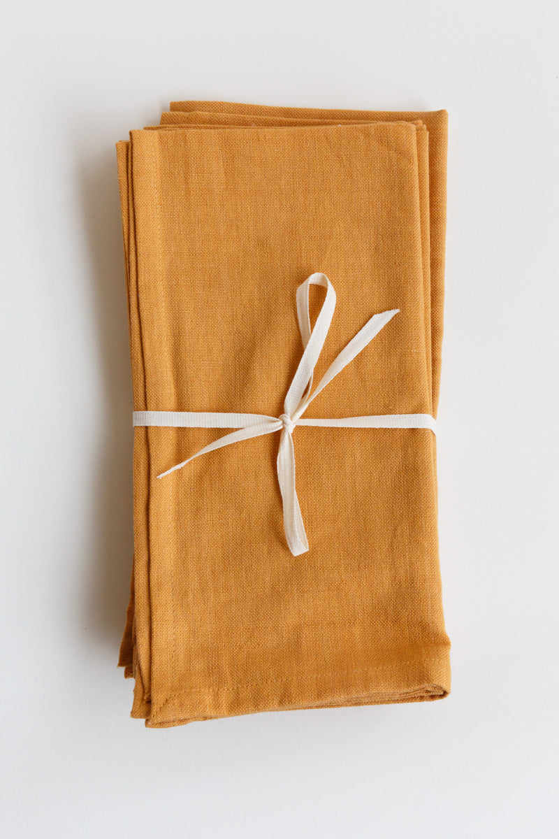Orange Natural Habitat solid napkin set handmade with 100% organic cotton using traditional craft techniques