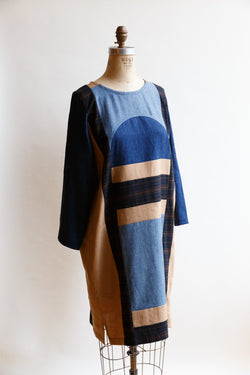 Handcrafted by Pamut Apparel and made from a mix of European linen, hemp/cotton, and handwoven cotton khadi, this Geometry Dress is inspired by a vintage quilt and is on display on a mannequin