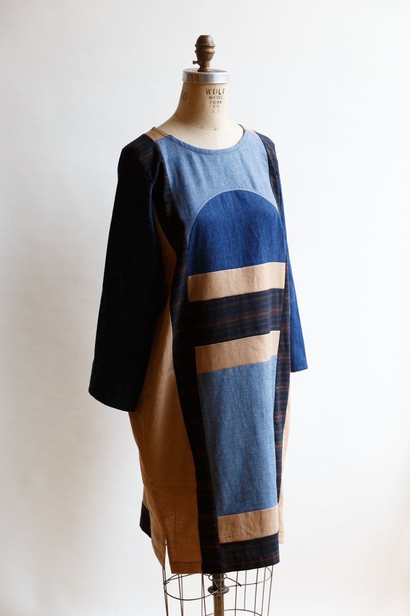 Handcrafted by Pamut Apparel and made from a mix of European linen, hemp/cotton, and handwoven cotton khadi, this Geometry Dress is inspired by a vintage quilt and is on display on a mannequin