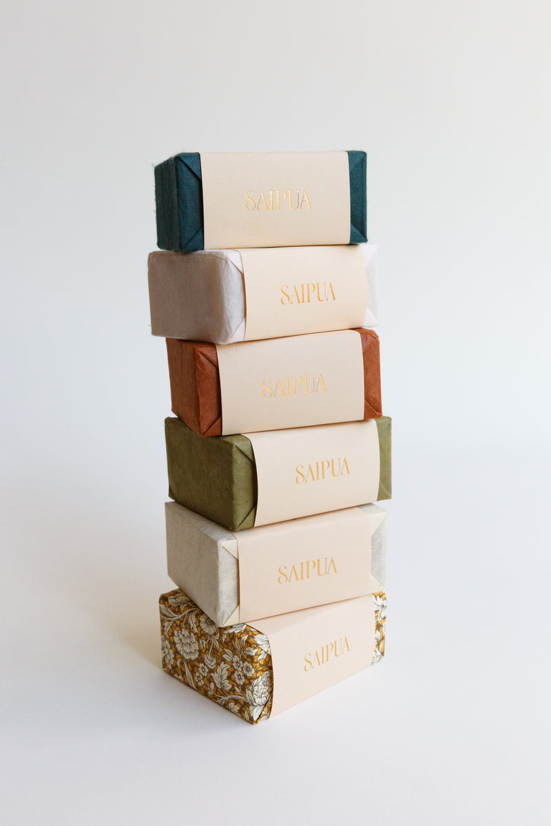 An arrangement of beautiful handcrafted Saipua Soaps made in New York and wrapped in beautiful handmade paper