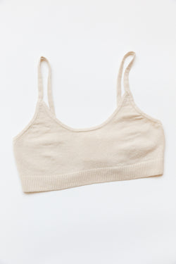 A cotton silk sporty bralette with bottom ribbing is on display on a flat table