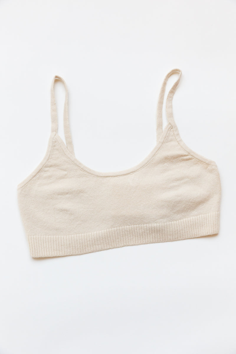 A cotton silk sporty bralette with bottom ribbing is on display on a flat table