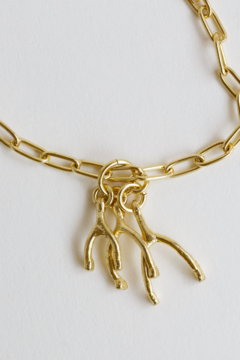 Satomi 3 Wishes Charm, cast in recycled brass, on a link chain necklace