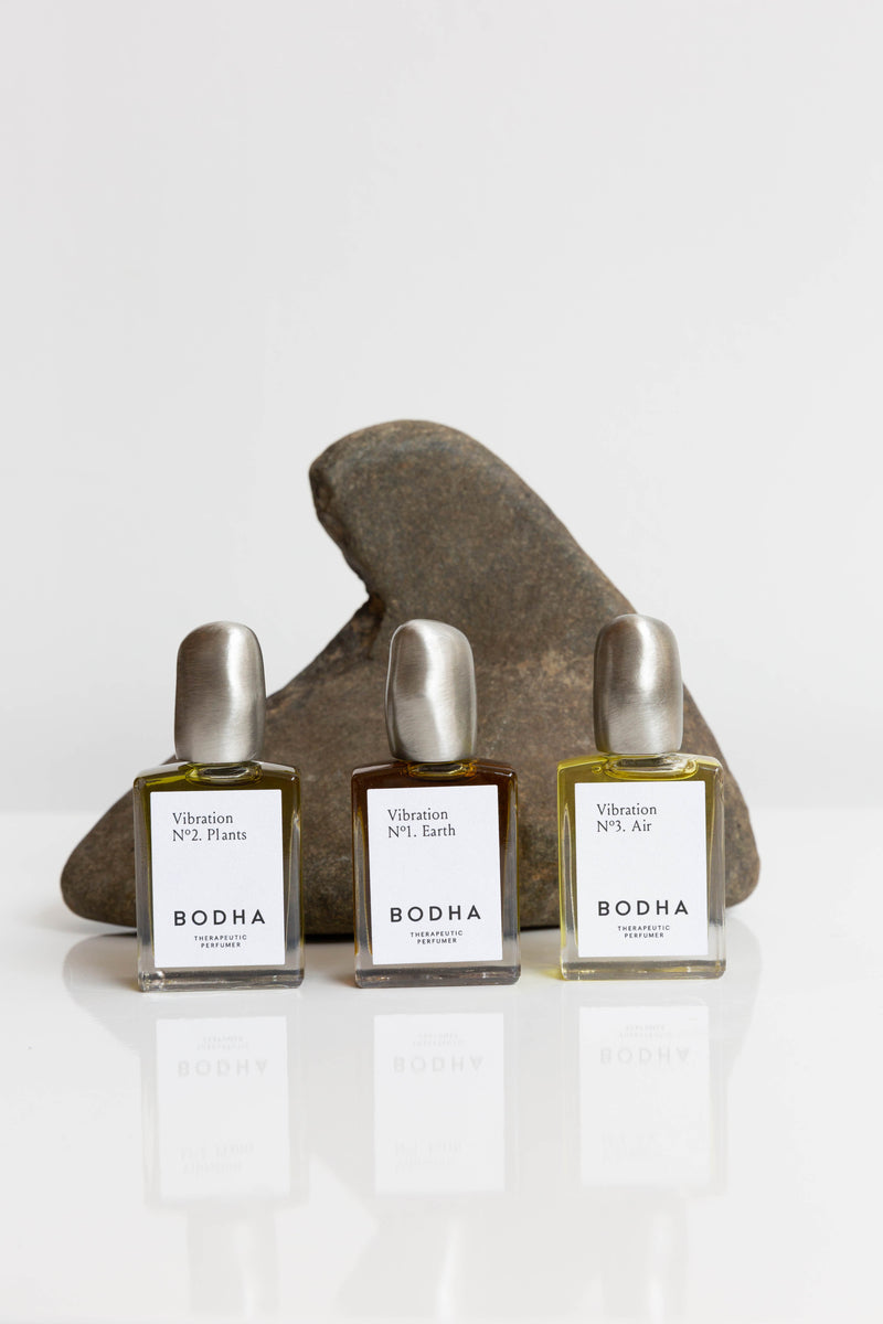 Bottles of Bodha Natural Perfume Oil, roller bottles with hand-cast bronze lid, made in Los Angeles with vegan and sustainably sourced ingredients