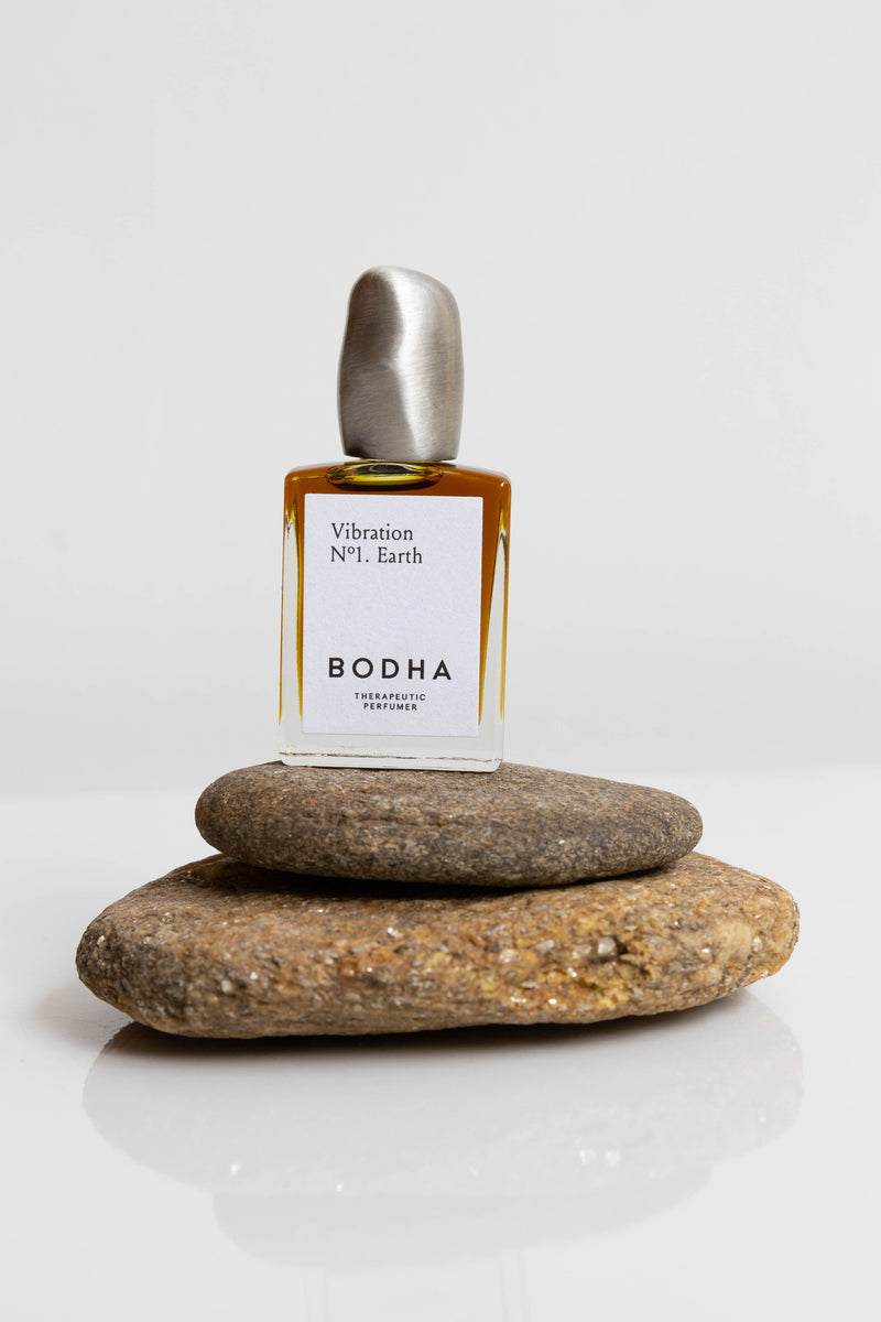 A bottle of Bodha Natural Perfume Oil, roller bottles with hand-cast bronze lid, made in Los Angeles with vegan and sustainably sourced ingredients