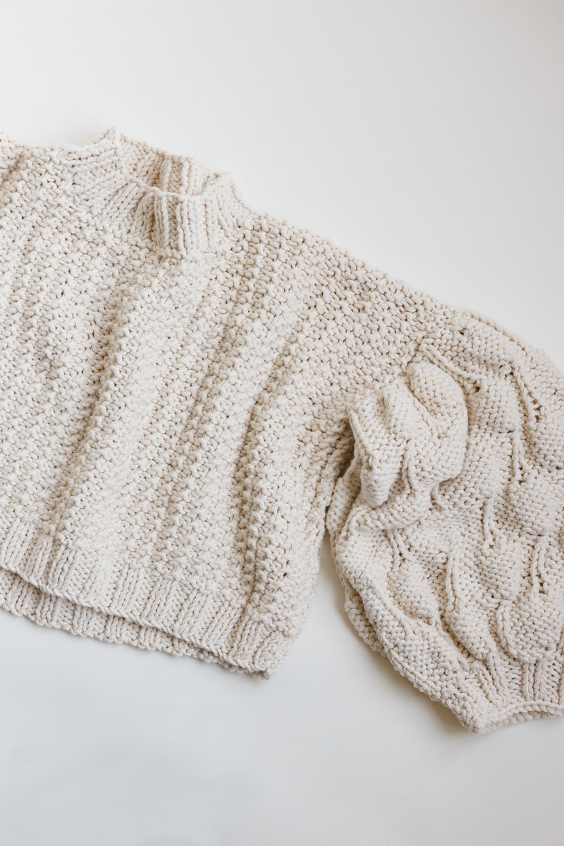 Handcrafted by women artisans in Argentina, this oversized chunky cotton pullover sweater features balloon sleeves from Ursa Textiles