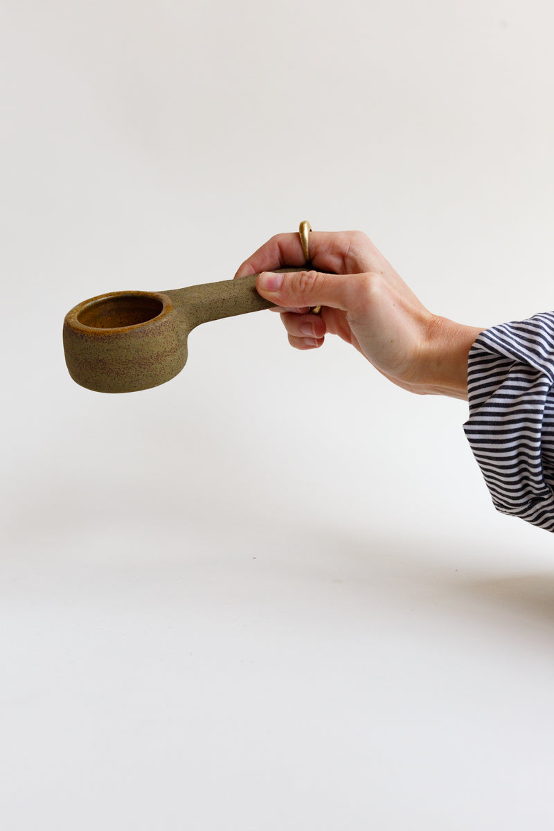 Person holding a Utility Objects Coffee Scoop